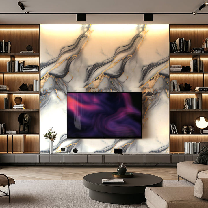 Modern living room with built-in bookshelves, a large TV mounted on Landmark Decor’s Cloudstone Stream Marble Durable PVC Wall, warm lighting, and a round coffee table in the center.