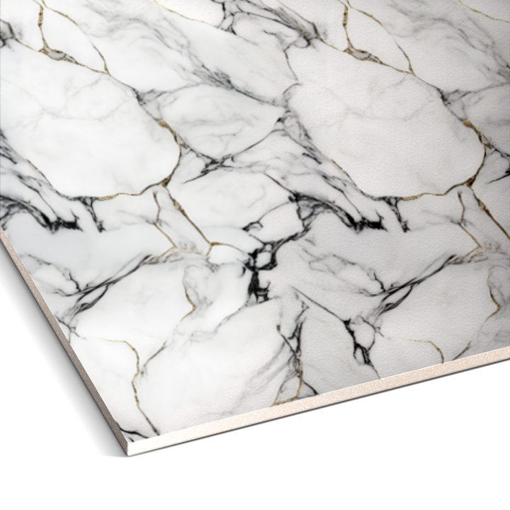 A close-up of the Onyx Snow Marble Durable PVC Wall slab from Landmark Decor showcases its luxurious white marble design with black and gold veining.