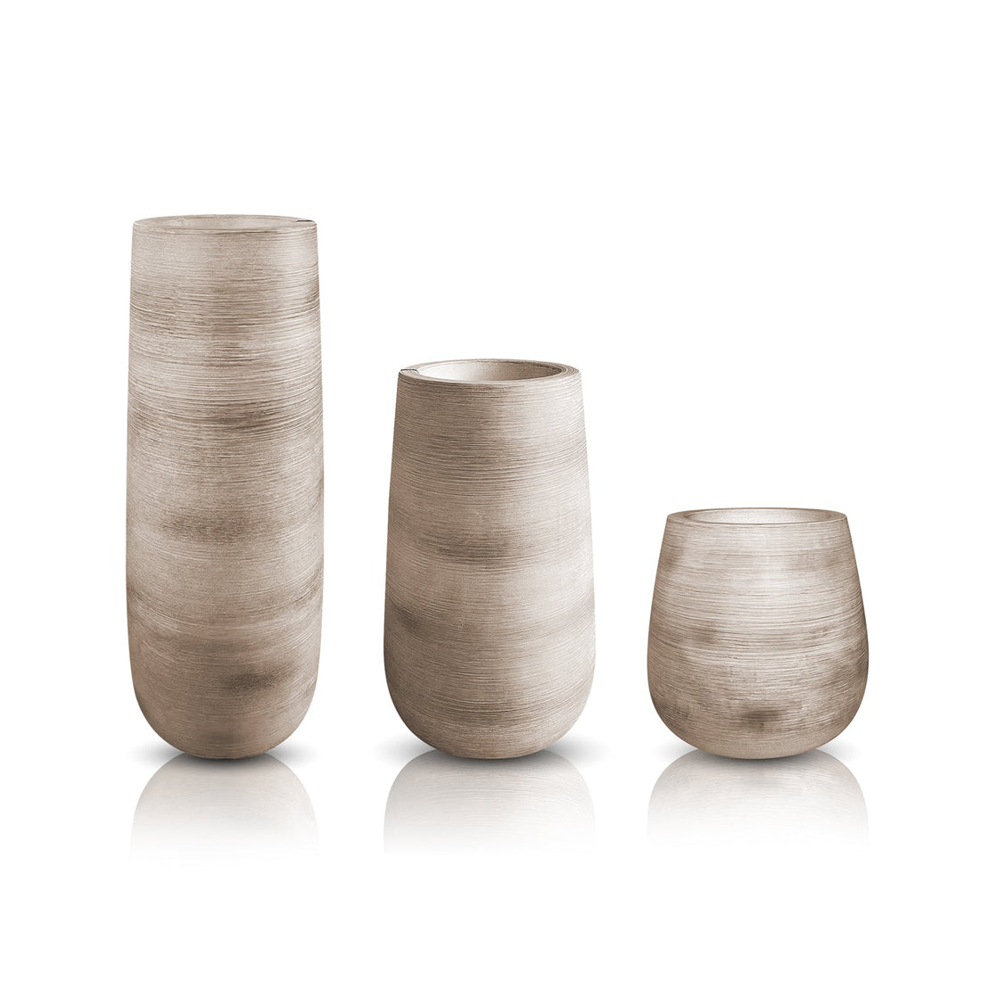The Artisan Luxe Planter - Full Set by Landmark Decor features three textured, beige vases in a row against a white backdrop. Handcrafted for luxury, the tallest is on the left, the medium in the center, and the shortest on the right—all with a smooth matte finish exuding nature’s elegance.