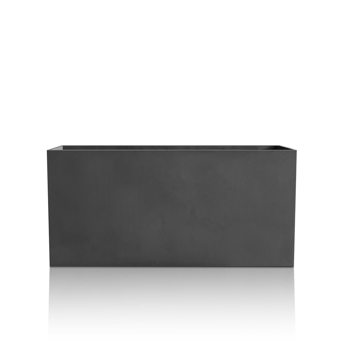 The Minimalist Oasis Planter - Large by Landmark Decor, a sleek rectangular black planter box, is showcased on a white reflective surface. Its smooth finish and straight lines highlight exquisite craftsmanship and a modern aesthetic that defines luxury planters.