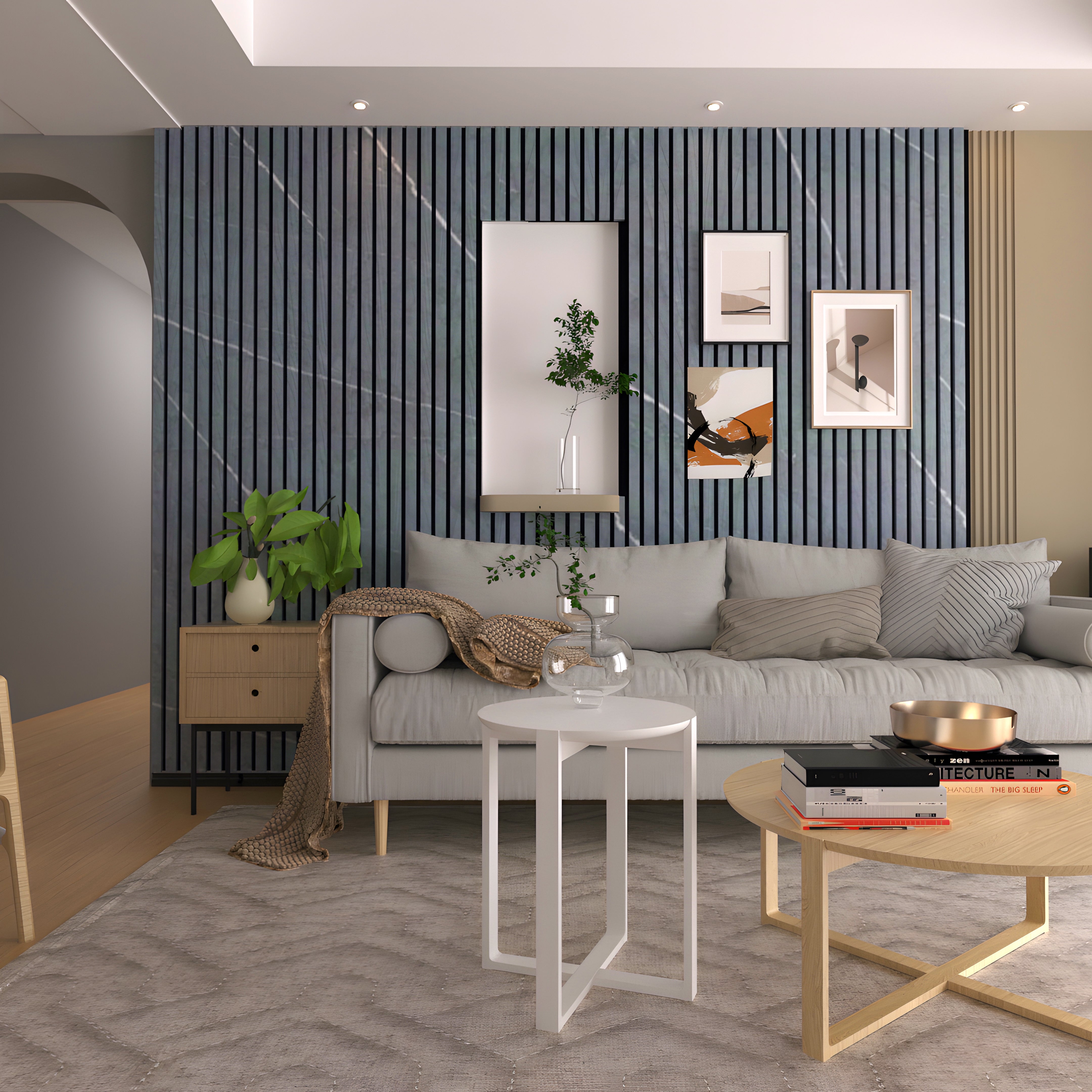 A modern living room with a gray sofa, Landmark Decor Black Marble WPC Fluted Slat Wall Panel accent wall, minimalist art, round coffee tables, and decorative plants.